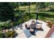 Aerial view of a charming outdoor patio with comfortable seating and well manicured landscaping at 6722 S Wolff Ct, Littleton, CO 80128