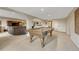 Spacious finished basement with pool table, bar area, and neutral carpeting at 5424 Hacienda Pl, Parker, CO 80134