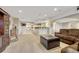 Open basement featuring a sitting area, bar, and large space for entertaining at 5424 Hacienda Pl, Parker, CO 80134