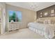 Comfortable bedroom featuring plush carpet, chandelier lighting, and bright window at 5424 Hacienda Pl, Parker, CO 80134
