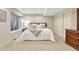 Cozy bedroom with neutral tones, carpet, a window and a comfortable bed at 5424 Hacienda Pl, Parker, CO 80134