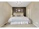 This spacious bedroom features modern design with a decorative wall and plush carpet at 5424 Hacienda Pl, Parker, CO 80134
