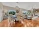Dining area with hardwood floors, decorative chandelier, and easy access to living spaces at 5424 Hacienda Pl, Parker, CO 80134