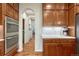 Stylish kitchen with stainless steel appliances, wood cabinets, and granite countertops at 5424 Hacienda Pl, Parker, CO 80134