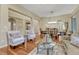 Bright and open living room with stylish furniture and hardwood floors at 5424 Hacienda Pl, Parker, CO 80134