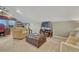 Comfortable living room features neutral color tones, plush seating, and a large window at 5424 Hacienda Pl, Parker, CO 80134