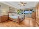 Spacious primary bedroom with hardwood floors and scenic views at 5424 Hacienda Pl, Parker, CO 80134