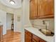 Convenient mudroom with wood cabinets, stone counters, and stylish decor at 5424 Hacienda Pl, Parker, CO 80134