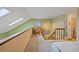 Sunlit bedroom with ensuite bathroom, dormer window, ceiling fan, and neutral decor on the upper level at 10530 W Jewell Ave # 303, Lakewood, CO 80232