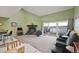 Bright living room with a large window overlooking the waterfront view and fireplace at 10530 W Jewell Ave # 303, Lakewood, CO 80232