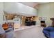 Spacious open floorplan with high ceilings, a view to the kitchen, and second floor at 10530 W Jewell Ave # 303, Lakewood, CO 80232