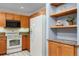 Kitchen showcasing matching appliances, wood cabinets, countertops, and tiled flooring at 315 Arapahoe Ave # 202, Boulder, CO 80302