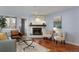 Cozy living room with hardwood floors, a fireplace, and comfortable seating with stylish decor at 315 Arapahoe Ave # 202, Boulder, CO 80302
