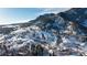 Scenic view of a mountainside covered in snow and trees, with homes nestled in the landscape at 315 Arapahoe Ave # 202, Boulder, CO 80302