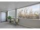 Covered patio area featuring chairs and a view of nature at 315 Arapahoe Ave # 202, Boulder, CO 80302