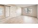 Bedroom with light wood floors and a bright window at 931 S Zeno Way # 107, Aurora, CO 80017