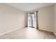Bedroom with wood floors, a sliding glass door, and neutral-colored walls at 931 S Zeno Way # 107, Aurora, CO 80017