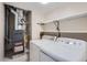 Laundry room with washer, dryer, furnace, and shelving at 931 S Zeno Way # 107, Aurora, CO 80017