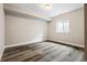 Bedroom featuring a wood floor and natural light from the window at 5695 Cadara Way, Parker, CO 80134