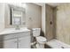 Bright bathroom features a shower with contemporary tile, a toilet, and a modern vanity at 18004 E Ohio Ave # 101, Aurora, CO 80017