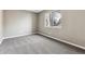 Neutral bedroom with wall-to-wall carpet and a window providing natural light at 18004 E Ohio Ave # 101, Aurora, CO 80017