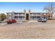 Condominium complex exterior with private balconies, stone accents, and dedicated parking at 18004 E Ohio Ave # 101, Aurora, CO 80017