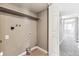 Unfinished laundry room with shelving, connections, and a utility sink at 18004 E Ohio Ave # 101, Aurora, CO 80017