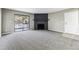 Living room featuring a fireplace and sliding doors to a patio at 18004 E Ohio Ave # 101, Aurora, CO 80017