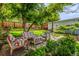 Seating area set in the backyard features landscaping and patio at 3116 S Lincoln St, Englewood, CO 80113