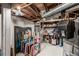 Unfinished basement with exposed ceiling and stored items presents an opportunity to customize at 3116 S Lincoln St, Englewood, CO 80113