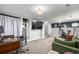 Spacious finished basement area with stairs, comfortable seating area, and exercise equipment at 3116 S Lincoln St, Englewood, CO 80113