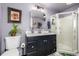 Bathroom featuring a modern vanity, framed mirror, and shower stall at 3116 S Lincoln St, Englewood, CO 80113