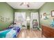 Bright bedroom featuring hardwood floors, lots of light, and whimsical touches at 3116 S Lincoln St, Englewood, CO 80113