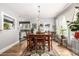 Inviting dining room showcasing hardwood floors, a stylish chandelier, and ample natural light, perfect for gatherings at 3116 S Lincoln St, Englewood, CO 80113