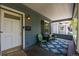 Inviting front porch with seating, a patterned rug, and a charming exterior design, perfect for relaxing at 3116 S Lincoln St, Englewood, CO 80113