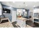 Spacious kitchen with a central island, granite countertops, and easy access to dining and living areas at 3116 S Lincoln St, Englewood, CO 80113