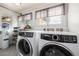 Laundry room with washer, dryer, shelves and windows at 3116 S Lincoln St, Englewood, CO 80113