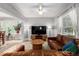 Cozy living room with natural light, plush seating, and a seamless transition to the dining area at 3116 S Lincoln St, Englewood, CO 80113