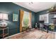 Inviting office space featuring custom paint and desk with a patterned rug and natural light at 3116 S Lincoln St, Englewood, CO 80113