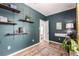 Inviting office space featuring custom paint and shelves with a patterned rug and natural light at 3116 S Lincoln St, Englewood, CO 80113