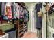 Walk-in closet with custom wood shelves and racks providing ample storage space for clothes and accessories at 3116 S Lincoln St, Englewood, CO 80113