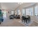 Inviting living room with a dining area, neutral tones, and ample natural light at 3678 Shadow Cir, Castle Rock, CO 80109