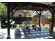 Relaxing back porch with comfortable seating beneath an overhead pergola at 8101 S San Juan Range Rd, Littleton, CO 80127