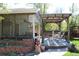 Back porch with overhead pergola offering comfortable outdoor space at 8101 S San Juan Range Rd, Littleton, CO 80127