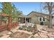 Landscaped backyard with a spacious patio, perfect for relaxation and outdoor dining at 8101 S San Juan Range Rd, Littleton, CO 80127