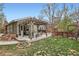 Spacious backyard deck with pergola, ideal for entertaining and relaxation at 8101 S San Juan Range Rd, Littleton, CO 80127
