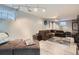 Finished basement with a cozy seating area, modern lighting, and ample space at 8101 S San Juan Range Rd, Littleton, CO 80127
