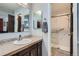 Stylish bathroom with modern fixtures, stone countertops, and a walk-in shower at 8101 S San Juan Range Rd, Littleton, CO 80127