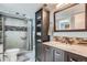Bathroom features an updated shower and vanity, blending style and functionality at 8101 S San Juan Range Rd, Littleton, CO 80127