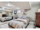 This bedroom features a closet with mirrored doors and is stylishly decorated at 8101 S San Juan Range Rd, Littleton, CO 80127